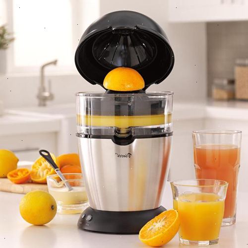 Hvordan laver appelsin juice. Proces appelsiner via feed røret.